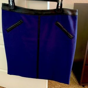 Petite short skirt, blue with black leather trim.